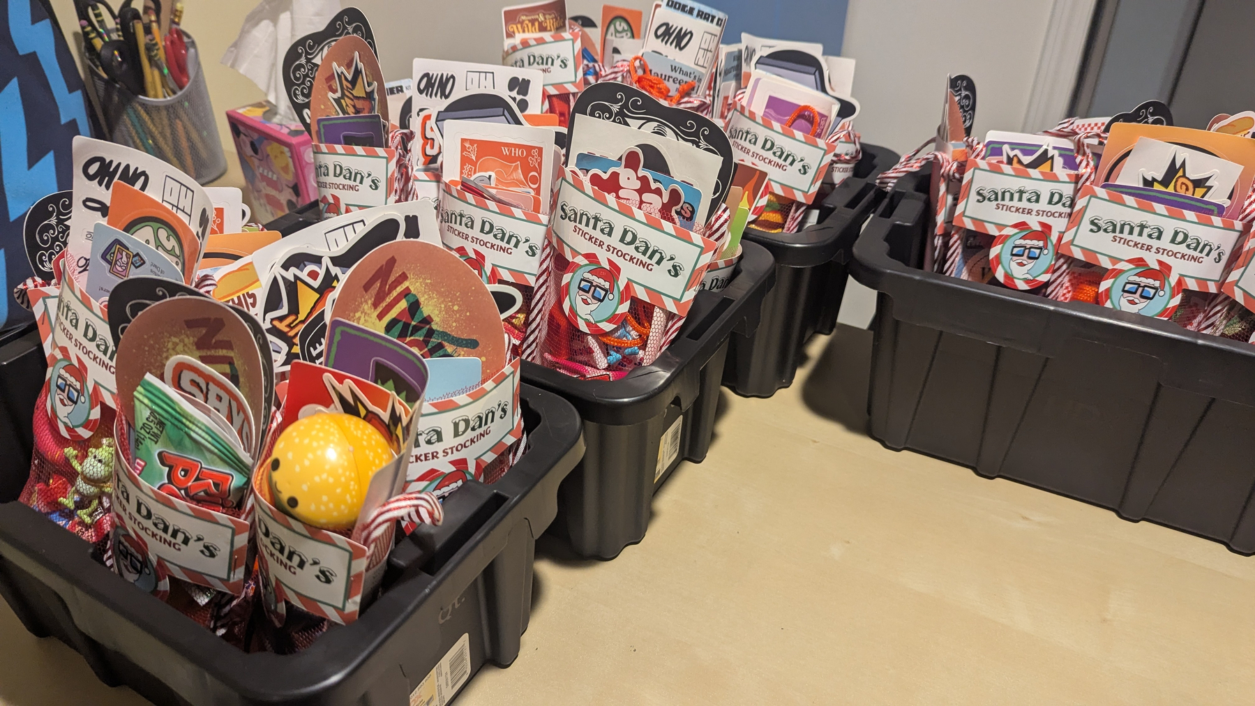 Bins filled with stockings stuffed with stickers and joy