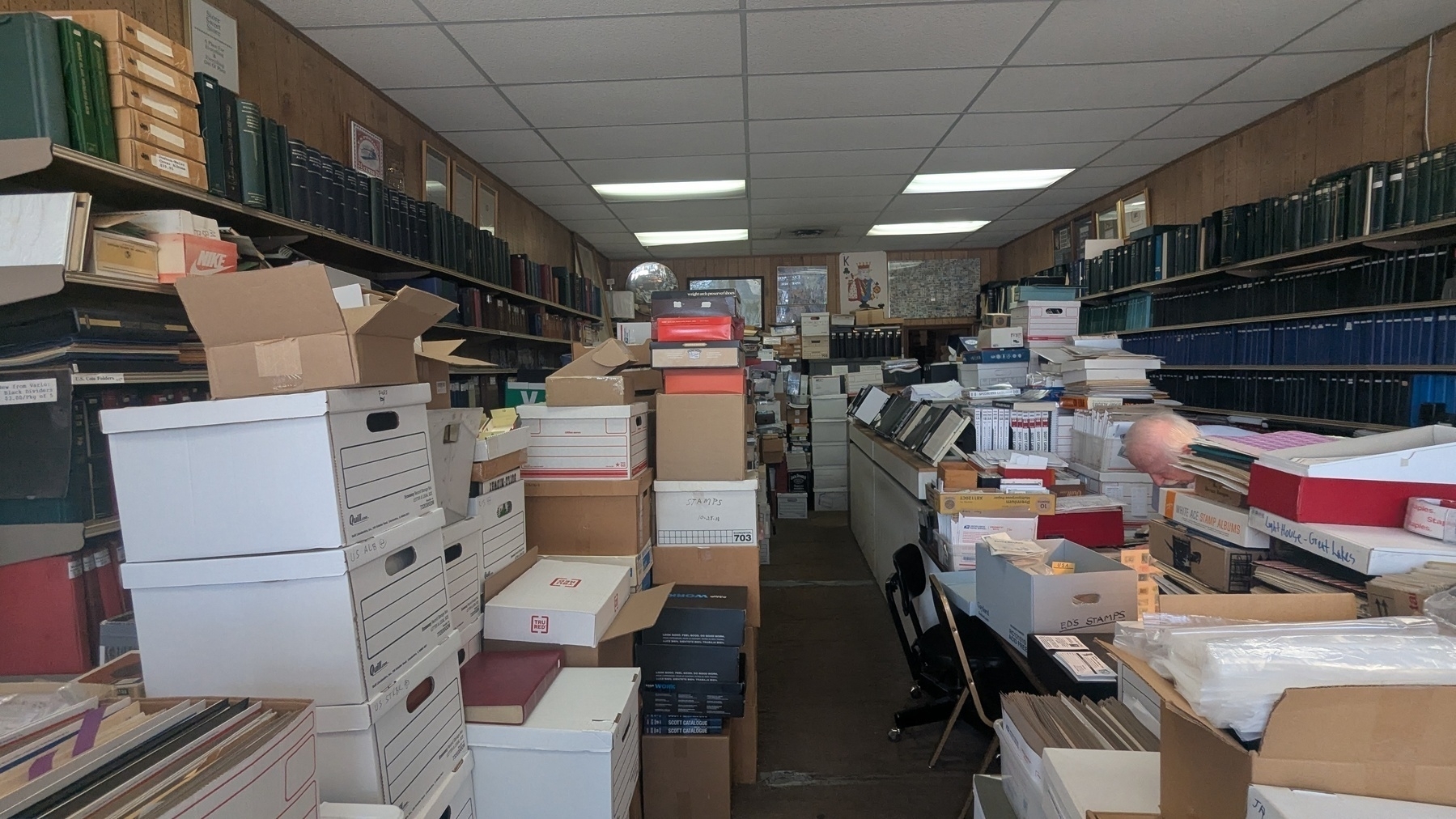 Full chaos inside The Stamp King.