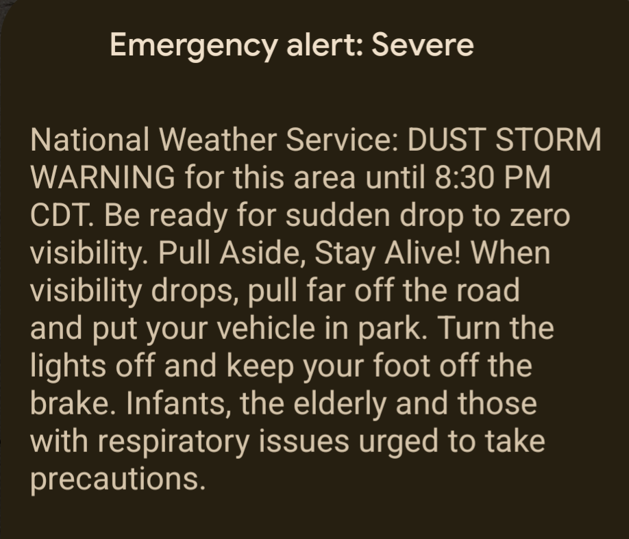 An emergency alert warns of a severe dust storm until 8:30 PM CDT, advising drivers to pull over and park safely while urging caution for vulnerable individuals.